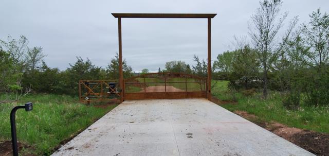 Corten steel entrance with overhead beam