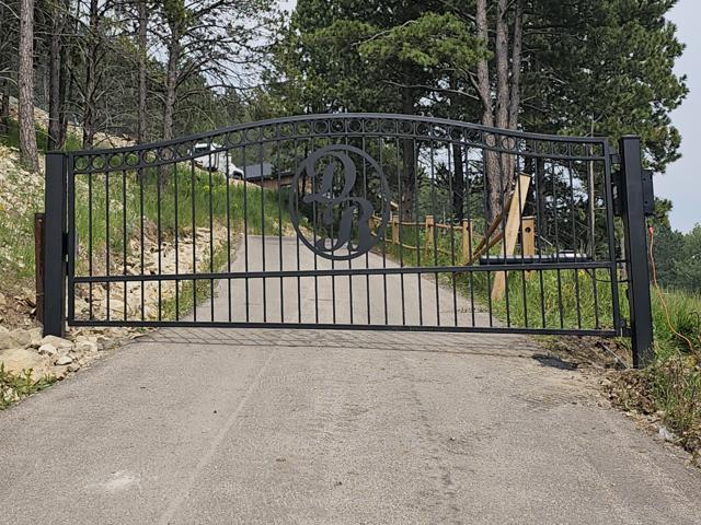 Arched gate with custom monogram