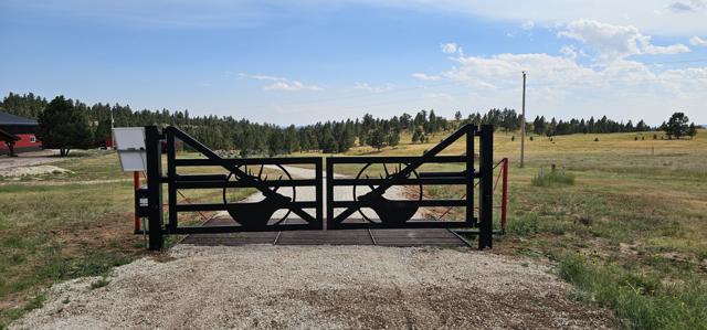 Elk silhouette gate over a cattle guard